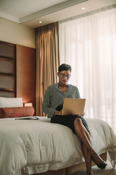 Business woman working from hotel room
