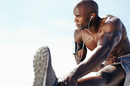 Shirtless man exercising outdoors