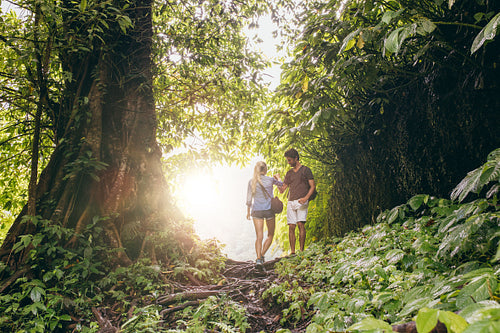 Couple hiking in tropical jungle