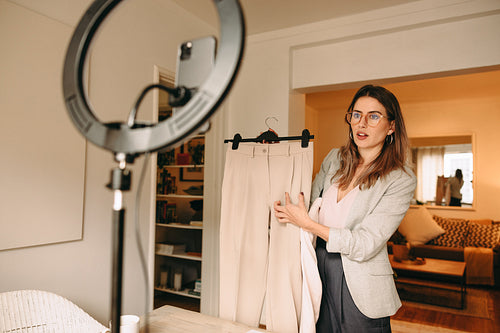 Fashion designer advertising her work on her social media channe