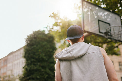 Streetball player standing outdoors on court 