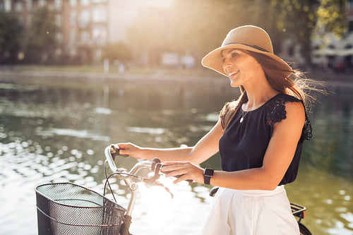 Woman with a bike at city park