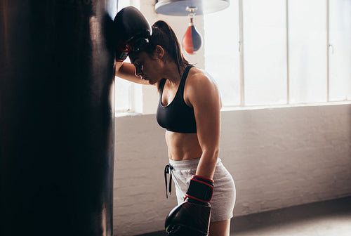 Female boxer training at a boxing studio 