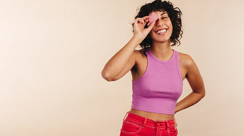Modern woman holding a menstrual cup in her hand