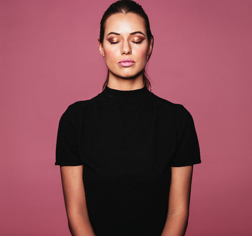 Beautiful relaxed woman with perfect skin and makeup