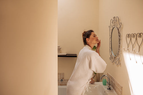 Female taking care of her facial skin