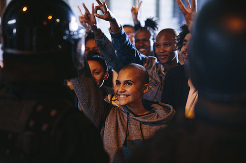 Activists celebrating their victory in front of police force