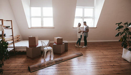 Young couple in love moving in a new apartment
