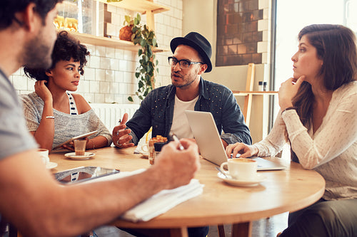 Creative people meeting at a cafe