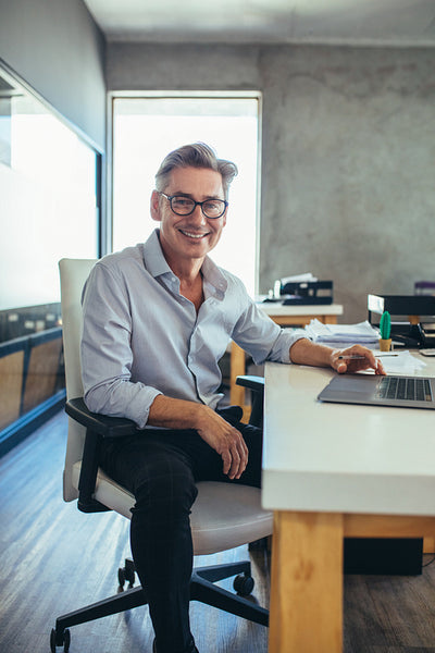 Mature businessman at his desk