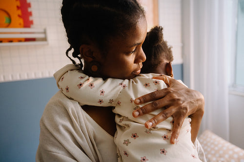Motherly embrace in cozy setting