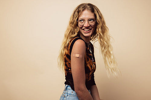 Woman looking happy after getting a vaccine