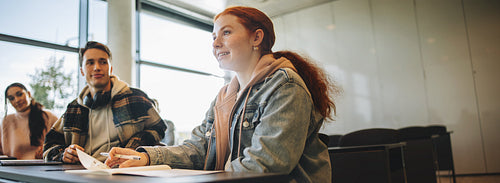 Girl student answering question in a classroom