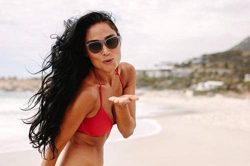 Beautiful woman blowing a kiss