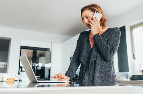 Woman managing office work from her home