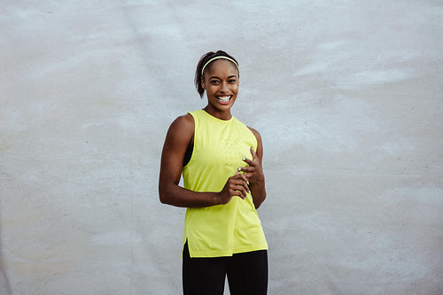 Smiling african woman in sportswear