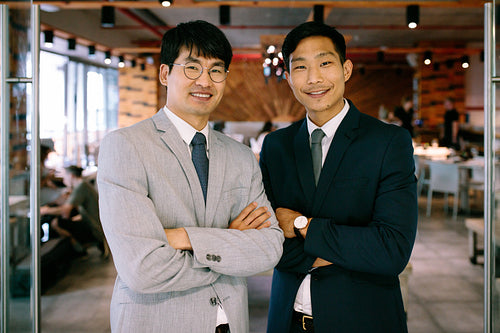 Successful business partners standing together