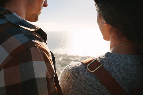 Traveler couple admiring seascape