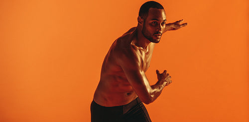 Fit man doing warm up exercises