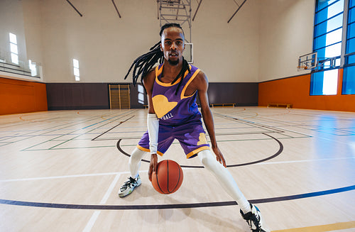 Basketball player dribbling with intensity in point of view challenge