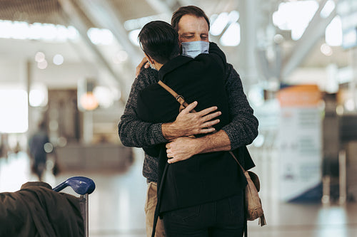 Man meeting his girlfriend in the airport