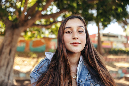Brunette teenage girl looking at the camera confidently