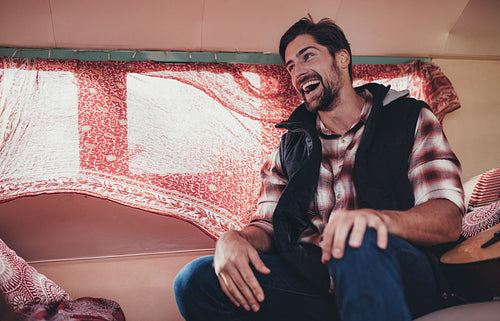 Smiling man on a road trip