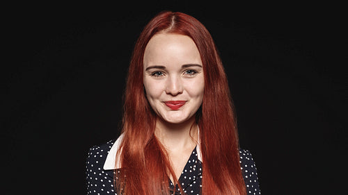 Smiling woman with long brown hair