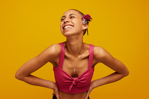 Beautiful woman with flowers on shaved head