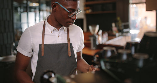 Barista preparing coffee at a coffee shop