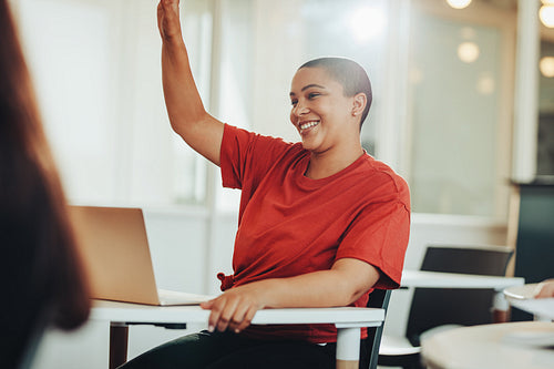 Student asking question to teacher in lecture