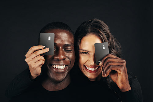 Banking with benefits: Couple holding their premium credit cards