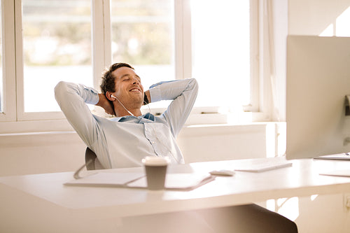 Entrepreneur relaxing sitting in front of computer