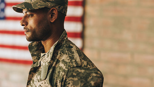 Courageous young soldier looking away