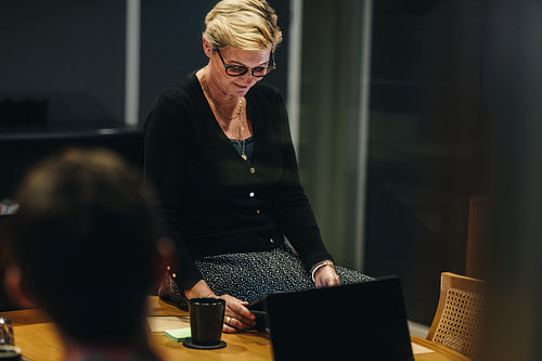 Businesswoman with digital tablet in meeting room