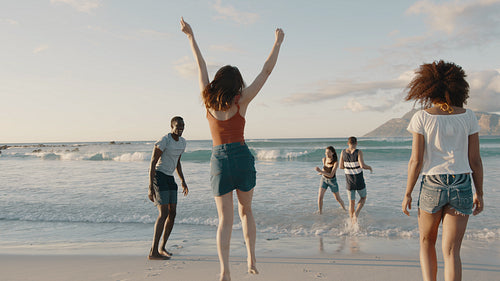 Group of happy friends having fun on summer beach