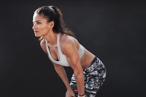 Muscular female model in sportswear