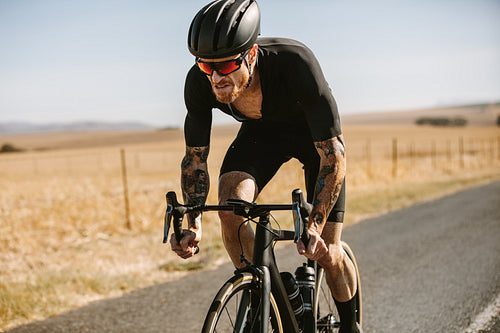 Active sportsman cycling road bike