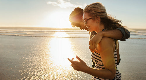 loving young couple enjoying a day on beach