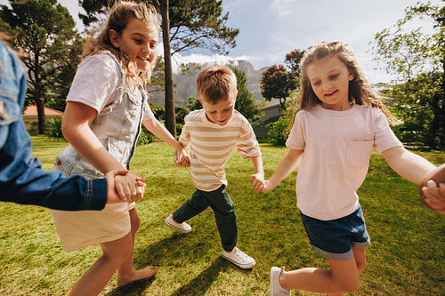 Children playing and enjoying outdoor activities together on a sunny day