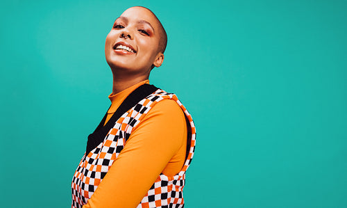 Female hipster smiling in a studio