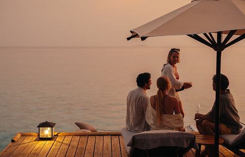 Quality time as a family during sunset on a holiday by the sea