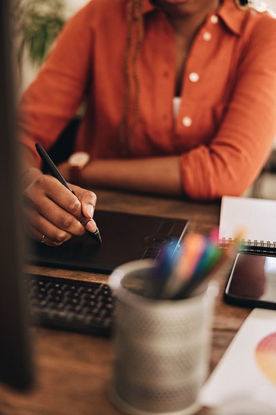 Graphic designer drawing on a digital tablet