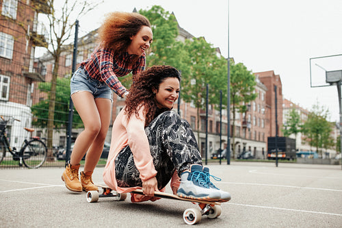 Young women enjoying skating outdoor