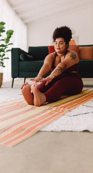 Body positive woman exercising at home