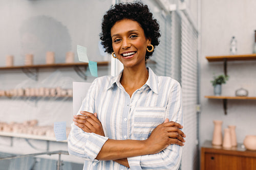 Successful small business owner smiling at the camera in an office