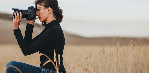 Pro photographer photographing outdoors