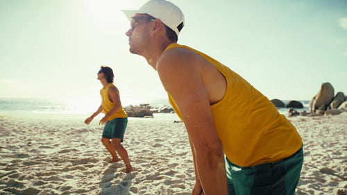 In the action: Male beach volleyball team displays skill and synergy during championship game