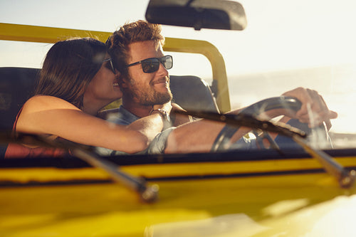 Romantic young couple sharing a special moment on road trip