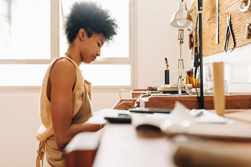 Woman crafting jewelry in workshop
